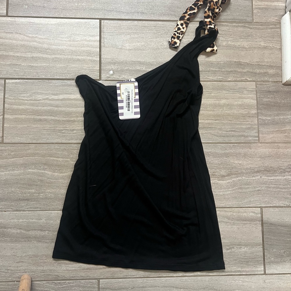 One shoulder tops. One hot pink, other black with leopard strap.